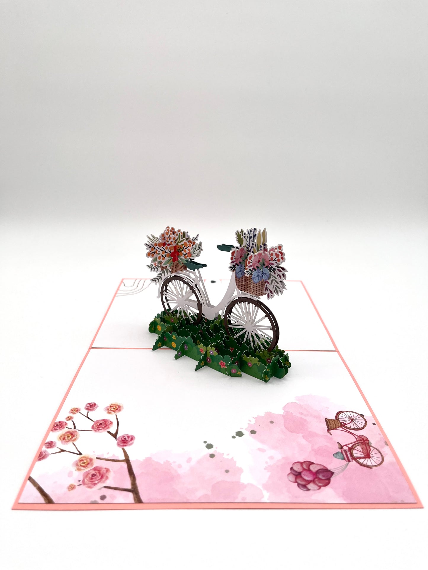 Fahrrad mit Blumenkorb auf der Wiese 3D Pop-Up