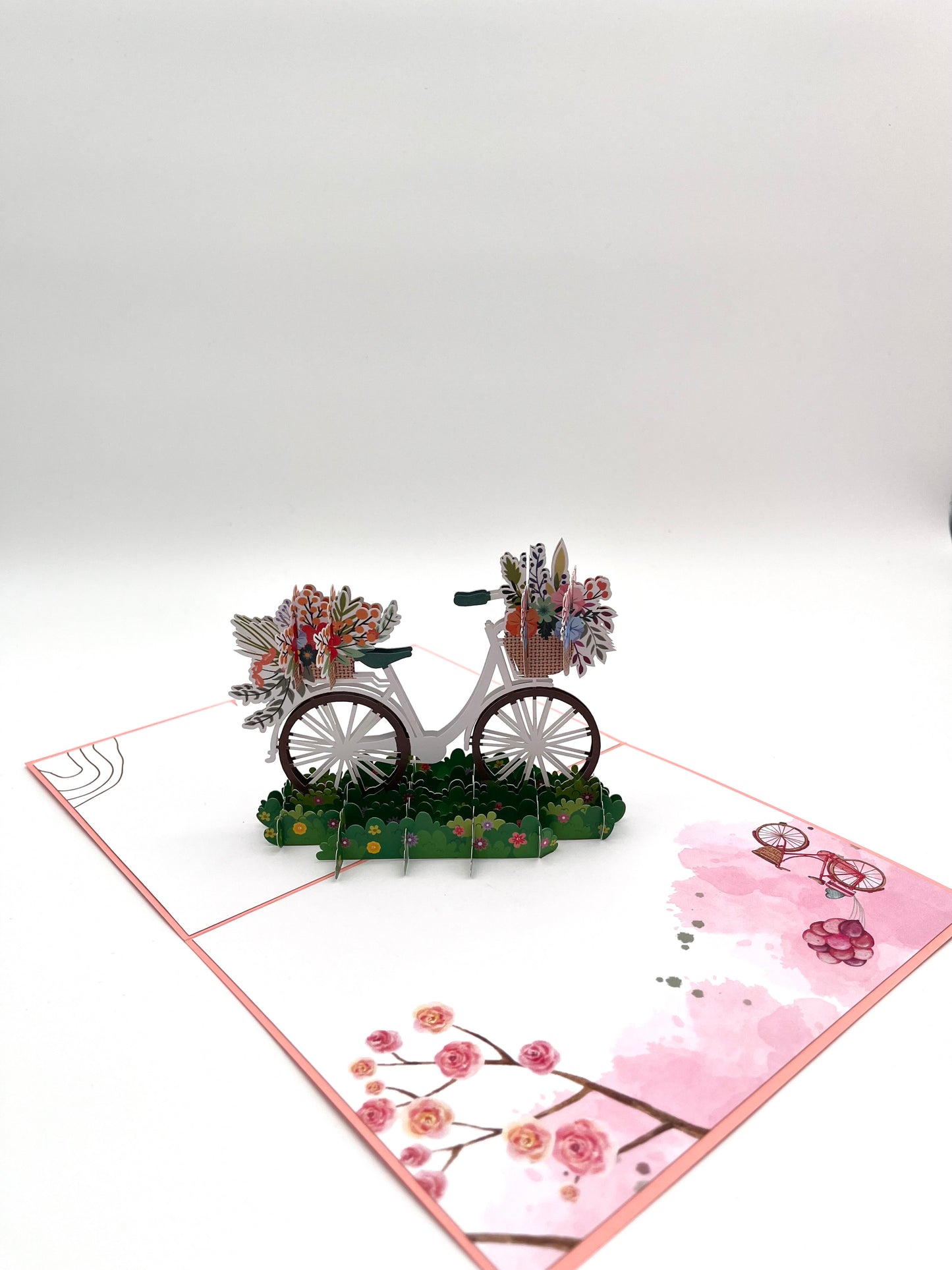 Fahrrad mit Blumenkorb auf der Wiese 3D Pop-Up